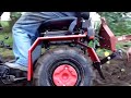 ploughing with a mini tractor mtz 132h