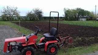 Ploughing with a mini tractor MTZ 132H