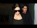 Kim Kardashian Shows Off Growing Baby Bump in Sheer Catsuit