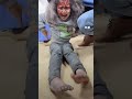 an injured girl is in agony on the hospital floor after an israeli air strike