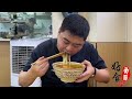 after 90 s in zhengzhou the young man sells sesame paste rice noodles. a bowl of rice noodles in 1