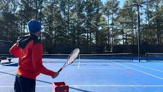 Tennis serve practice, working on coiling body for effortless power. 32F today.