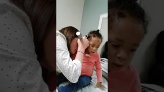 Dr checking my daughter's ears