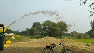 Surjeet Thresher 7 fen on John Deere tractor