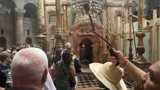 The daily incense ritual at the Holy Sepulchre by Orthodox, Armenian, and Coptic deacons.