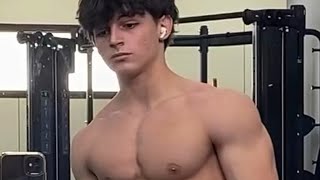 18 years old teen boy flexing muscles