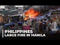 Philippines fire: Blaze tears through hundreds of homes in Manila