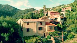 Small village Corsica near Gulf of Porto aerial view 4K UHD