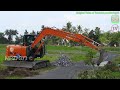 mini excavator hitachi zaxis 90 digging road trench drain construction