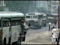 overloaded buses in kolkata people hang out of them