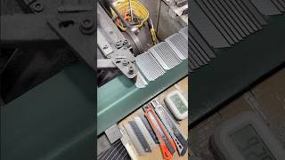 Utility blade production in progress