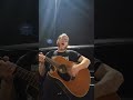 bobcat playing acoustic guitar in a walmart parking lot in lafayette la