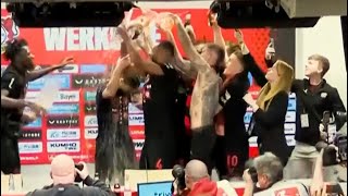 Bayer Leverkusen players shower Xabi Alonso in BEER during Bundesliga title press conference