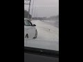 Moment Ohio police officer dodges truck sliding on icy highway