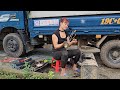 Girl repairs and maintains the oil tank of a car.