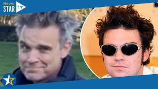 Robbie Williams ditches his popstar image and he rocks his long salt and pepper locks 597727