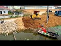 Bulldozer D31P working push stone and Dump truck T5 unloading stone filling into the water.