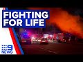 Two firefighters in hospital, one fighting for life after Queensland fire | 9 News Australia