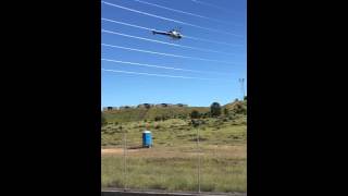 Helicopter Installing Spacers on Power Line