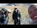 woman solo hiking to amazing georgia glacier gergeti glacier on mt kazbek georgia russia border