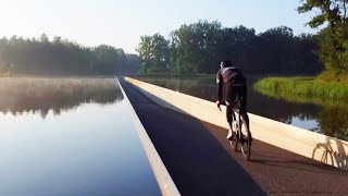 Cyclists Bike Through Water in This Belgian Lake