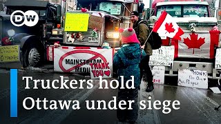 Canada police clear 'Freedom Convoy' trucks from Ambassador Bridge | DW News