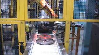 Vision-guided rivet-press tending robot handling clutch plates