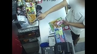 Brave female cashier fends off armed robber | CCTV English