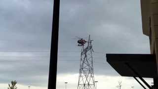 Amazing helicopter working on power lines.