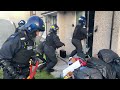 osg officers chainsaw through neighbouring front doors