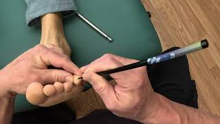 Raynor foot reflexology massage using chopsticks on Vlad using GoPro