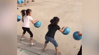 Kindergarten kids master basketball bouncing game