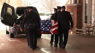 John Dingell's casket put into hearse