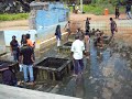 people bathing in the hot water wells in eastern province sri lanka . lali bro.