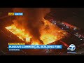 Massive fire engulfs commercial building in Commerce