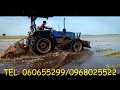 Solis tractor working at Field​ In Cambodia-ត្រាក់ទ័រសូលីស កំពុងធ្វើការងារលើដីស្រែ និងចំការ