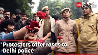 'Dilli police baat karo, aao humare saath chalo': Protesters offer roses to khaki-clad