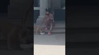 Doja Cat gives water to a Dog