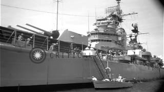 A white steamer moves towards USS Saint Paul (CA-73) at Manila Bay in Philippines...HD Stock Footage