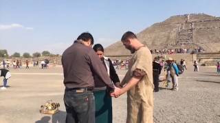 Preaching in front of Teotihuacan pyramid and praying for a boy with cerebral palsy