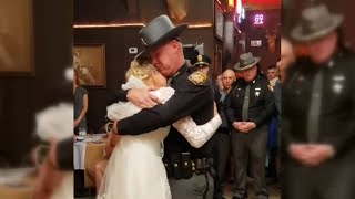 'Fathers in blue' surprise bride for father-daughter wedding dance