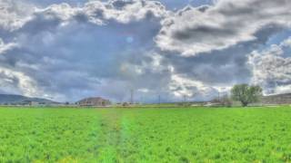 Time Lapse Tone Mapped Clouds Field Panning