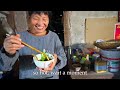 huge traditional hotpot in countryside cooking for the guests crispy meat pork feet dumplings