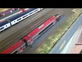 Automatic wheel cleaning for a model railway