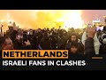 Israeli football fans clash with protesters in Amsterdam