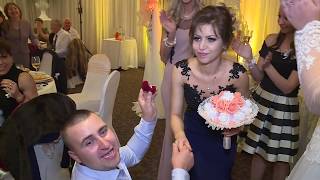 Surprise marriage proposal during wedding bouquet toss