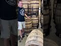 Looking inside a fresh dumped bourbon barrel