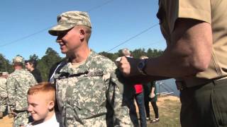 MAJ Lisa Jaster's husband pins Ranger Tab on her shoulder