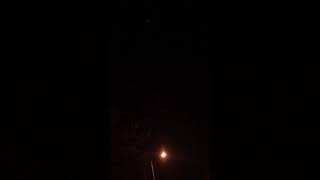 Strange bright light moving in zigzaglines at night sky .