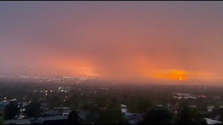 Onlookers amazed as lightning flashes during sunset in Salt Lake City